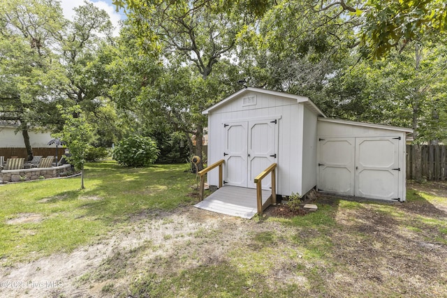 121 NW 1st St, Oak Island, NC 28465 - view of shed with fence