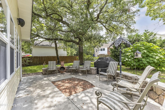 121 NW 1st St, Oak Island, NC 28465 - view of patio / terrace with a fenced backyard and a grill