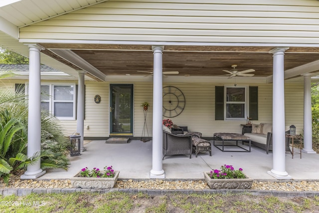 121 NW 1st St, Oak Island, NC 28465 - doorway to property with ceiling fan, covered porch, and an outdoor hangout area
