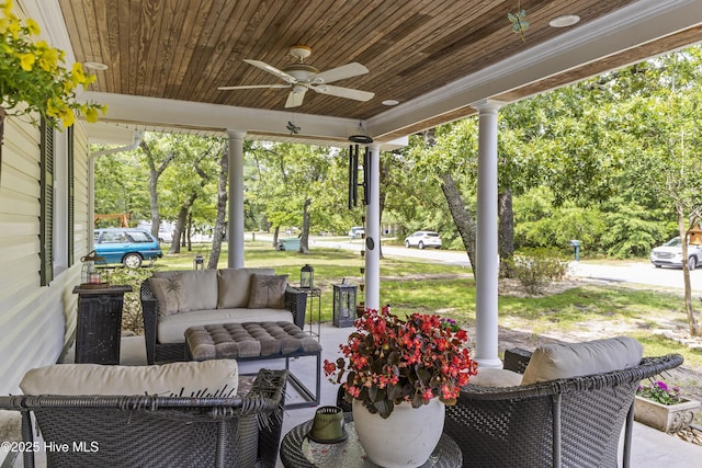 121 NW 1st St, Oak Island, NC 28465 - view of patio featuring a ceiling fan, outdoor lounge area, and covered porch