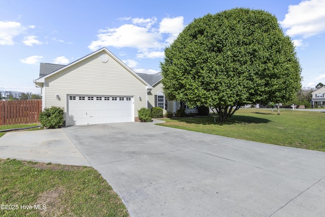 ranch-style house featuring an attached garage, a front lawn, fence, and driveway