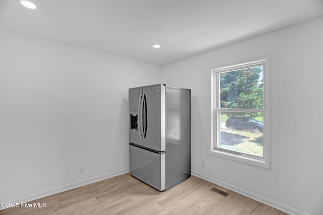 811 Crawford St, Goldsboro, NC 27530 - kitchen with visible vents, baseboards, light wood-type flooring, recessed lighting, and stainless steel fridge with ice dispenser