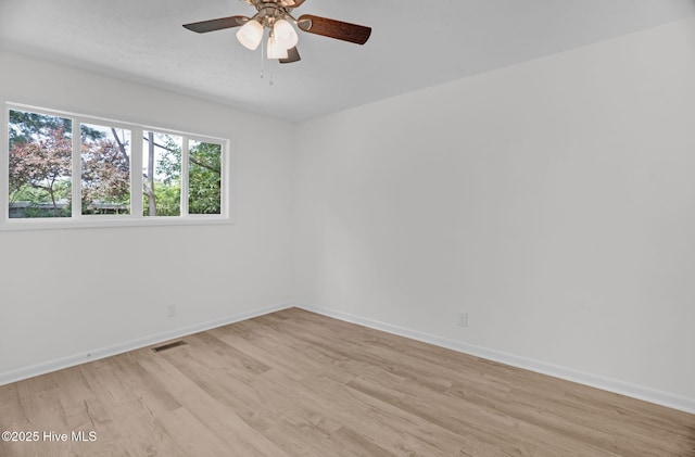 811 Crawford St, Goldsboro, NC 27530 - empty room featuring visible vents, light wood finished floors, ceiling fan, and baseboards