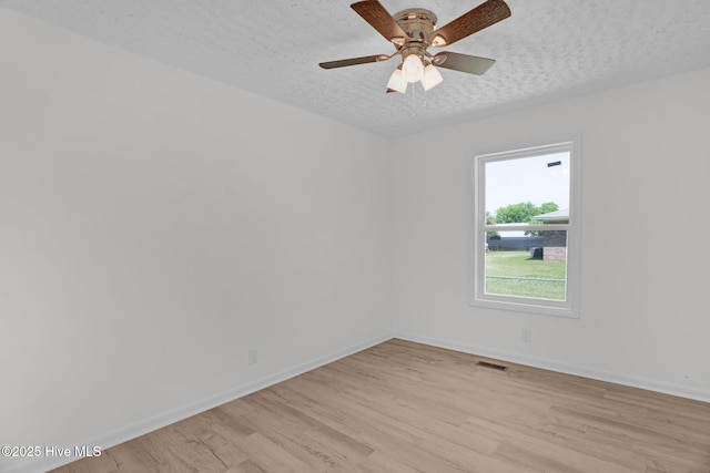 811 Crawford St, Goldsboro, NC 27530 - unfurnished room with visible vents, a textured ceiling, light wood-style flooring, and baseboards