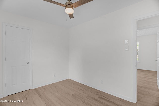 811 Crawford St, Goldsboro, NC 27530 - empty room with light wood-style floors, baseboards, and ceiling fan