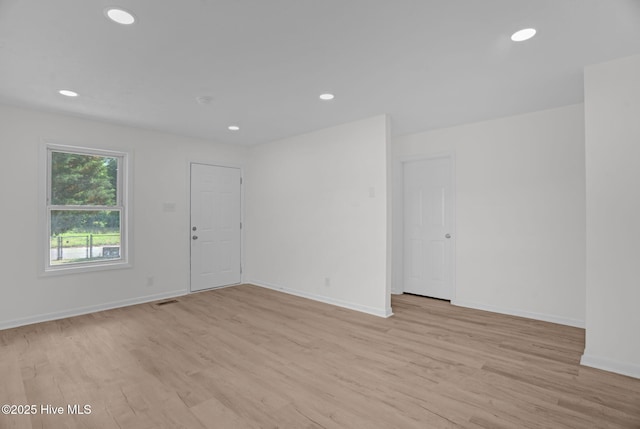 811 Crawford St, Goldsboro, NC 27530 - empty room with light wood-style floors, baseboards, and recessed lighting