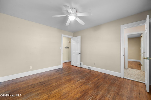 unfurnished bedroom featuring wood-type flooring, a ceiling fan, and baseboards