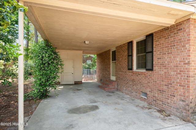 view of patio with an attached carport and entry steps