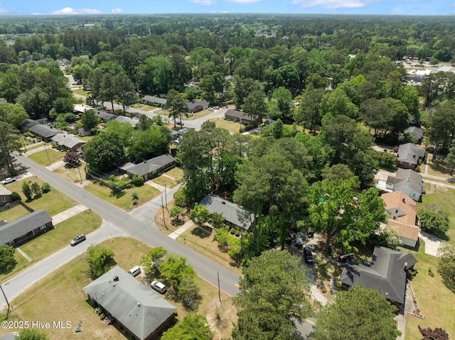 bird's eye view with a forest view and a residential view