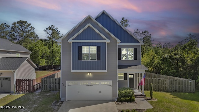view of front of home featuring board and batten siding, a front yard, fence, concrete driveway, and an attached garage
