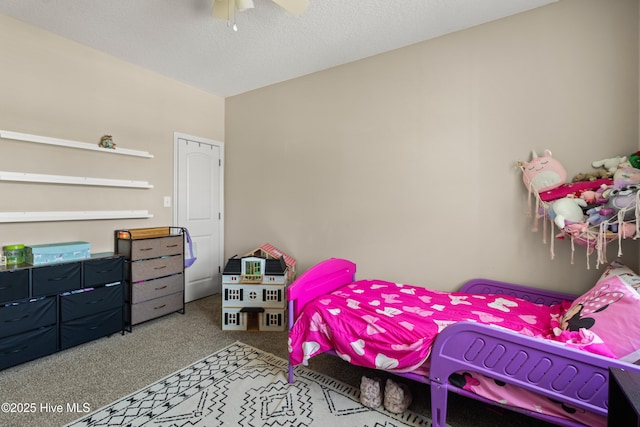 bedroom featuring ceiling fan and carpet