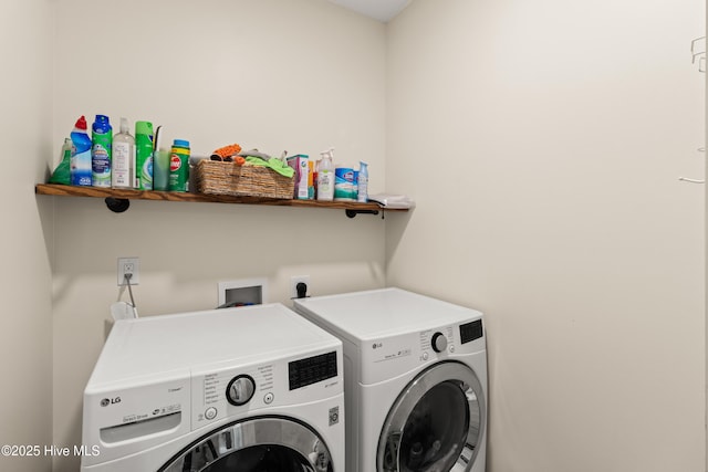 laundry area featuring washer and dryer and laundry area
