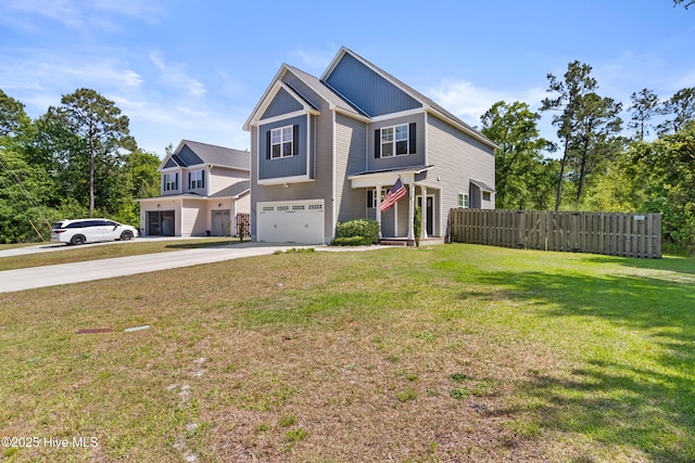 craftsman house featuring a garage, fence, a front yard, and concrete driveway