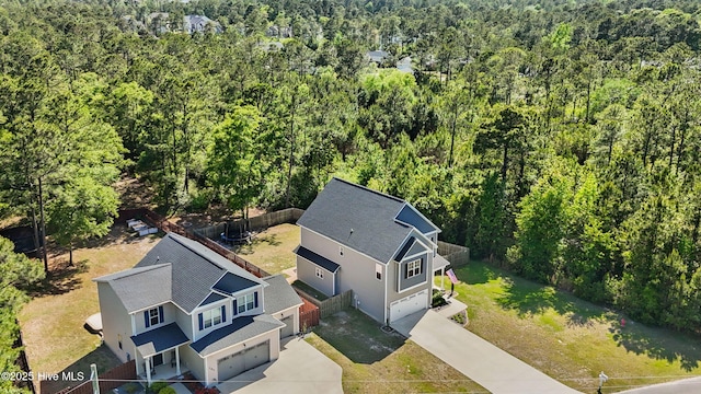 bird's eye view featuring a forest view