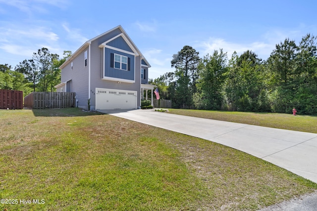 view of side of home featuring an attached garage, fence, a yard, and concrete driveway