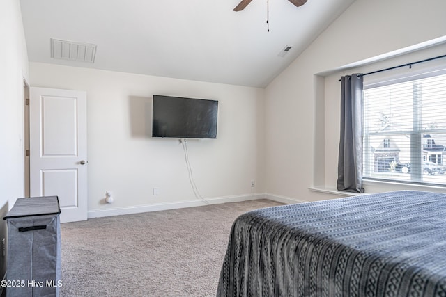 carpeted bedroom featuring a ceiling fan, baseboards, visible vents, and vaulted ceiling