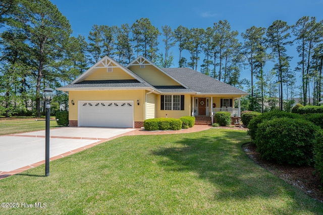 1071 Ridge Walk Way NW, Calabash, NC 28467 - view of front facade featuring covered porch, roof with shingles, driveway, a garage, and a front yard