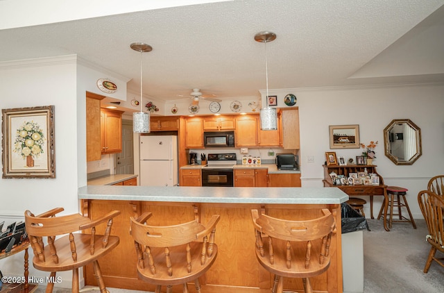 1071 Ridge Walk Way NW, Calabash, NC 28467 - kitchen featuring freestanding refrigerator, black microwave, crown molding, electric stove, and light countertops