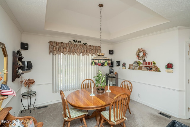 1071 Ridge Walk Way NW, Calabash, NC 28467 - dining room featuring baseboards, visible vents, crown molding, a raised ceiling, and carpet floors