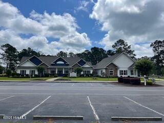 1071 Ridge Walk Way NW, Calabash, NC 28467 - uncovered parking lot with a residential view