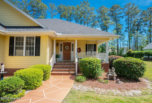 1071 Ridge Walk Way NW, Calabash, NC 28467 - doorway to property with covered porch and a shingled roof
