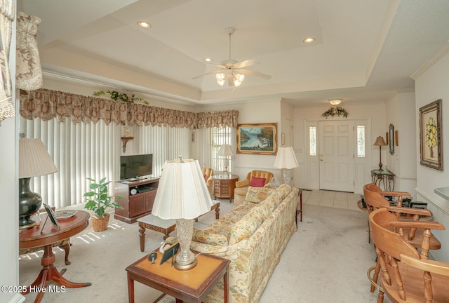 1071 Ridge Walk Way NW, Calabash, NC 28467 - living area with a raised ceiling, ceiling fan, and light carpet