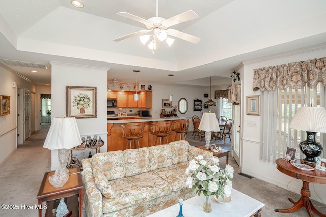 1071 Ridge Walk Way NW, Calabash, NC 28467 - living area with a raised ceiling, ceiling fan, visible vents, and light colored carpet