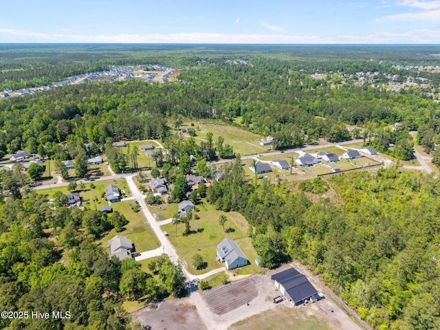 aerial view with a residential view and a wooded view