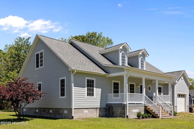 view of front of house with covered porch, an attached garage, a shingled roof, and a front lawn