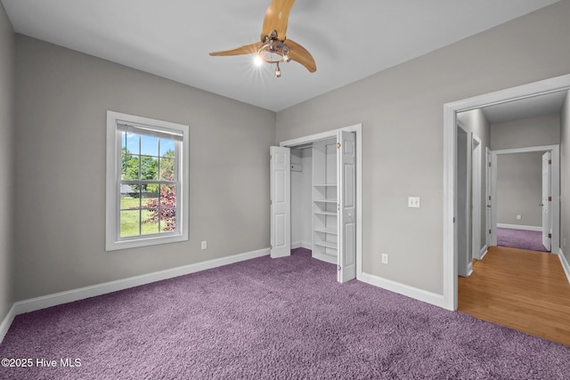 unfurnished bedroom featuring carpet floors, baseboards, and a closet