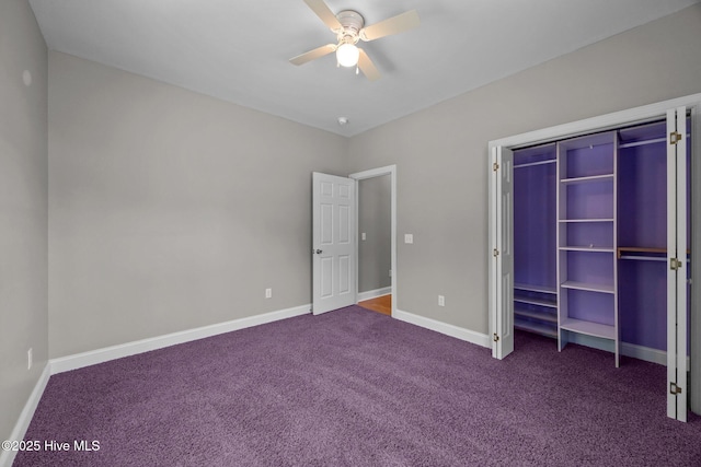 unfurnished bedroom with a ceiling fan, baseboards, and dark colored carpet