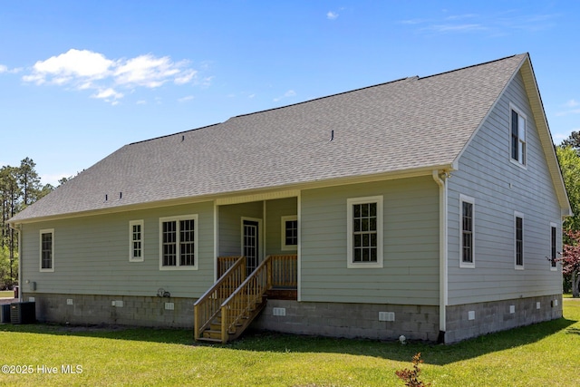 back of house with a lawn, central air condition unit, a shingled roof, and crawl space