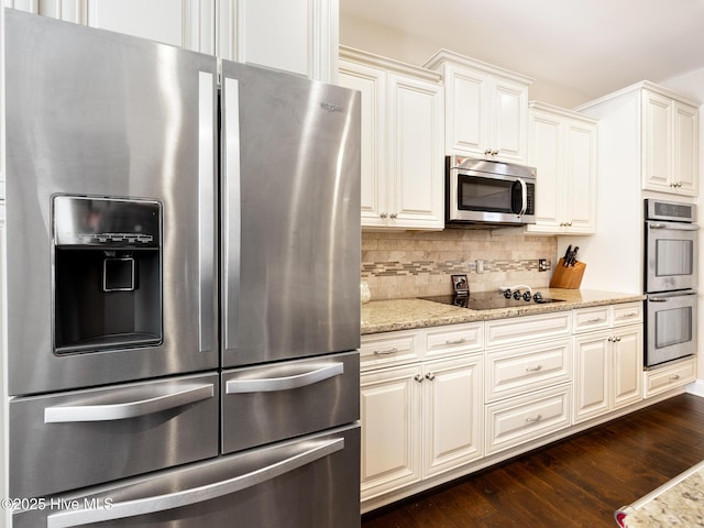 114 Schever Rd, West End, NC 27376 - kitchen featuring decorative backsplash, dark wood-type flooring, white cabinetry, light stone counters, and appliances with stainless steel finishes