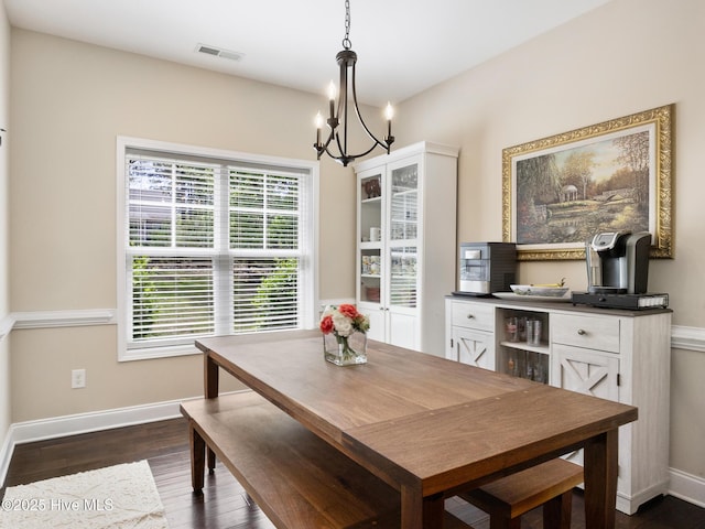 114 Schever Rd, West End, NC 27376 - dining room featuring visible vents, dark wood-style flooring, baseboards, and a chandelier