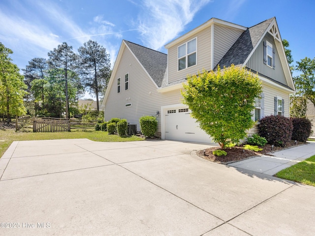 114 Schever Rd, West End, NC 27376 - view of property exterior with a garage, roof with shingles, fence, and concrete driveway
