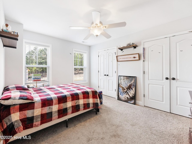 114 Schever Rd, West End, NC 27376 - bedroom featuring carpet flooring, a ceiling fan, and multiple closets