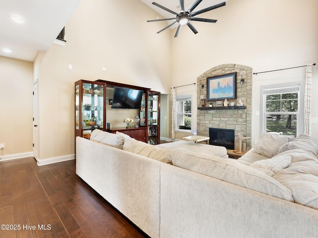 114 Schever Rd, West End, NC 27376 - living room featuring baseboards, a ceiling fan, dark wood-type flooring, and a towering ceiling