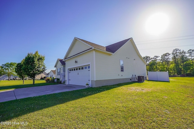 view of side of home featuring concrete driveway, a lawn, central AC, and a garage