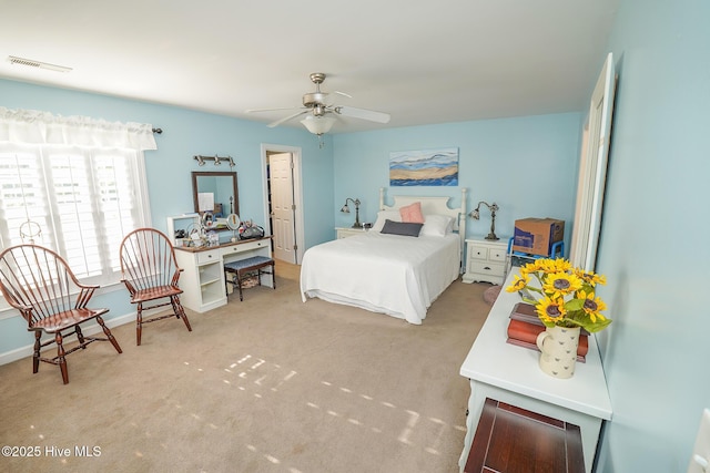 carpeted bedroom with baseboards and visible vents