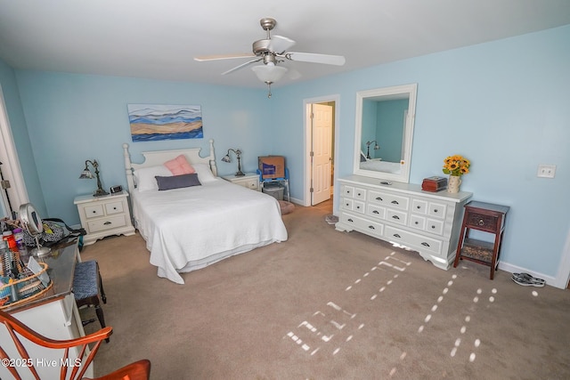 carpeted bedroom with baseboards and ceiling fan
