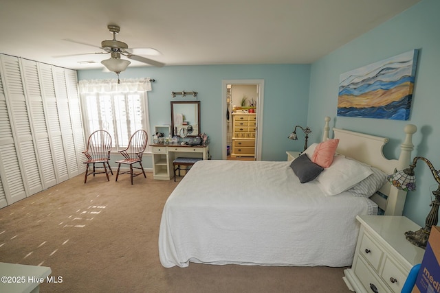 carpeted bedroom with a closet and a ceiling fan