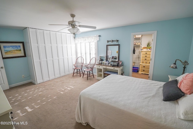 carpeted bedroom featuring a ceiling fan and a closet