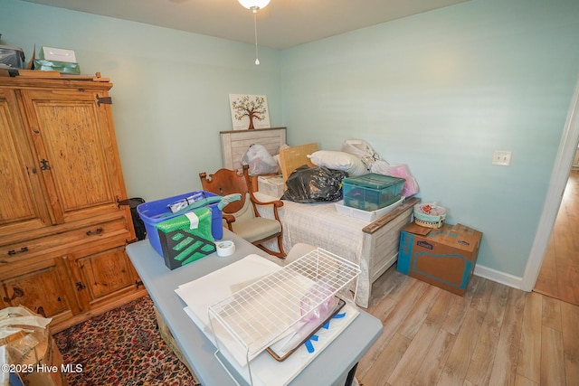 bedroom with baseboards and light wood-style flooring