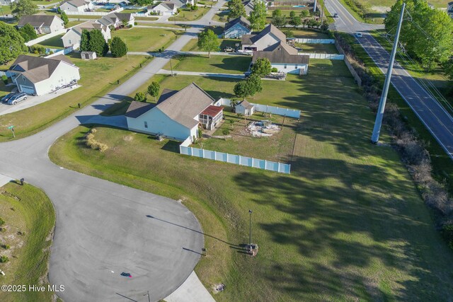 birds eye view of property with a residential view
