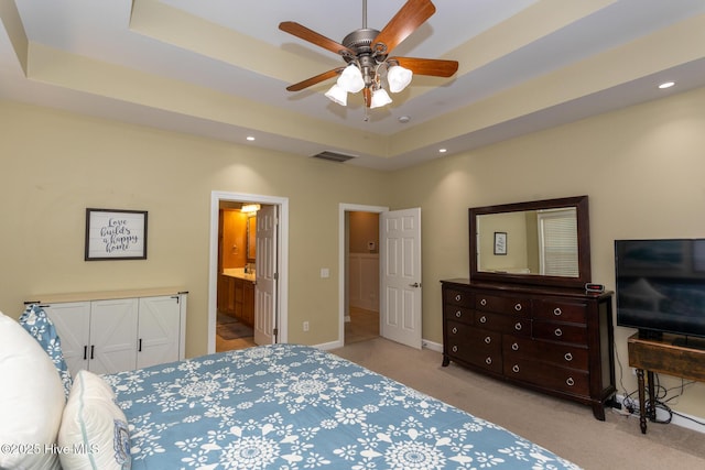 bedroom featuring visible vents, carpet floors, baseboards, a raised ceiling, and recessed lighting