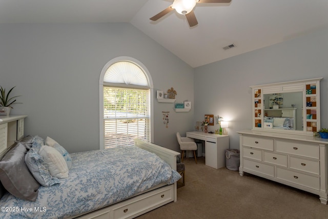 carpeted bedroom with a ceiling fan, vaulted ceiling, and visible vents