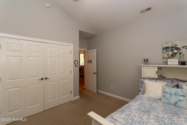 bedroom with visible vents, a closet, baseboards, carpet, and vaulted ceiling