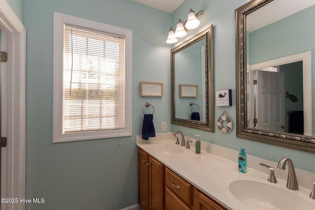 full bath with double vanity and a sink