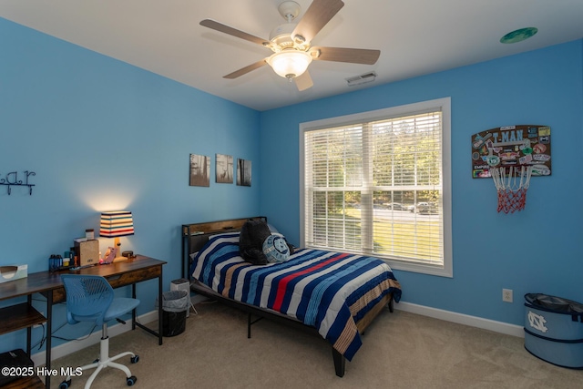 bedroom featuring carpet flooring, a ceiling fan, baseboards, and visible vents