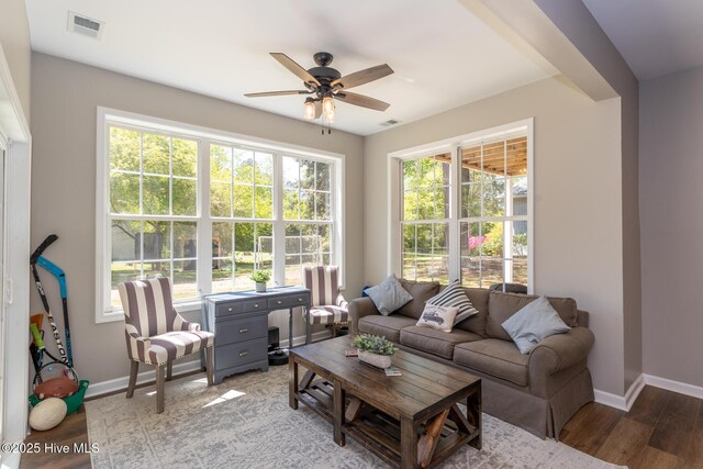 95 Glen Cove Ln, West End, NC 27376 - living room featuring baseboards, a ceiling fan, and light wood-style floors